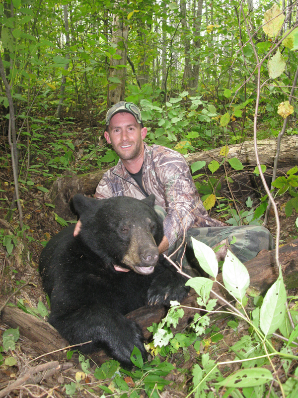 P.J. Cashman with a 300-pound plus black bear taken with Northern Wisconsin Outfitters his first day on stand.