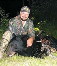 Photo of guide Mike Foss with Bear 2006