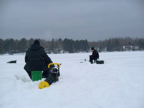 men ice fishing