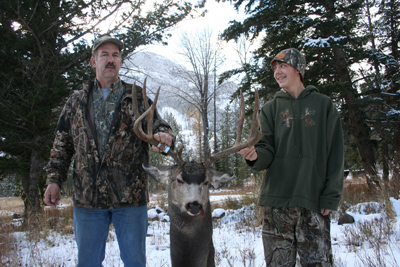 Mike and Spencer Carson with buck