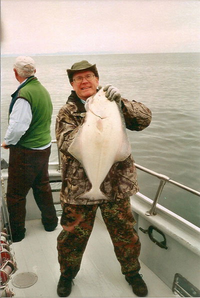 man holding Alaskan Halibut