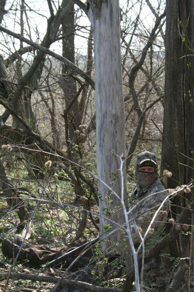 photo of camoflauged Dick Ellis is wooded area