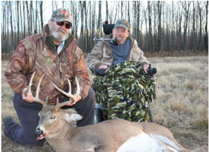 Posing for a picture with our great buck.