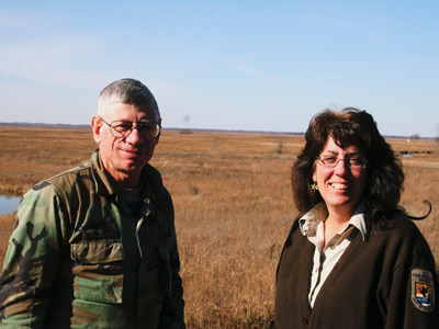 Wisconsin trapper Arnold Groehler of Oconomowoc and Diane Kitchen, Assistant Refuge Manager, stand in front of Horicon Marsh