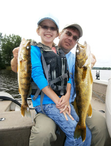 Eric Tufto and his daughter Annie with a couple of good eating Wisconsin River walleyes