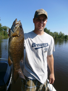 Dustin Linzmeier with a nice smallmouth bass from Lake Dubay