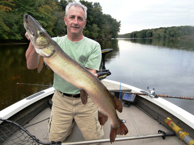 Gary Cawthorne with his first musky. (Note the custom Elk River Rod in the background)