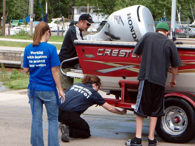 Working with Boaters to Protect our Waters is the message on the t-shirts worn by our CBCW watercraft inspectors all around the state of Wisconsin